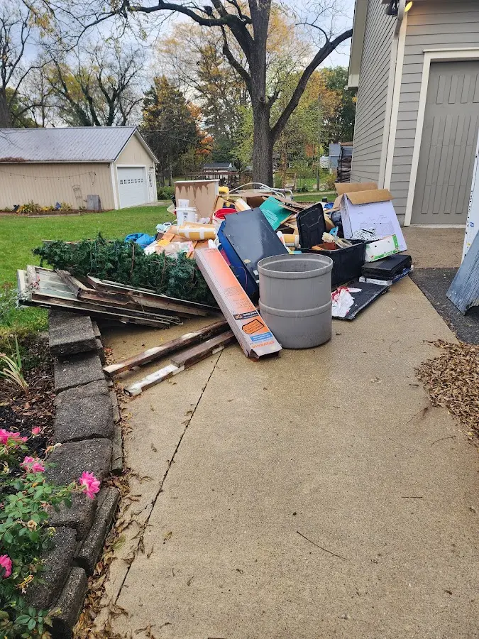 Dumpster being loaded with debris for 30 Yard Dumpster Rental in Lovejoy
